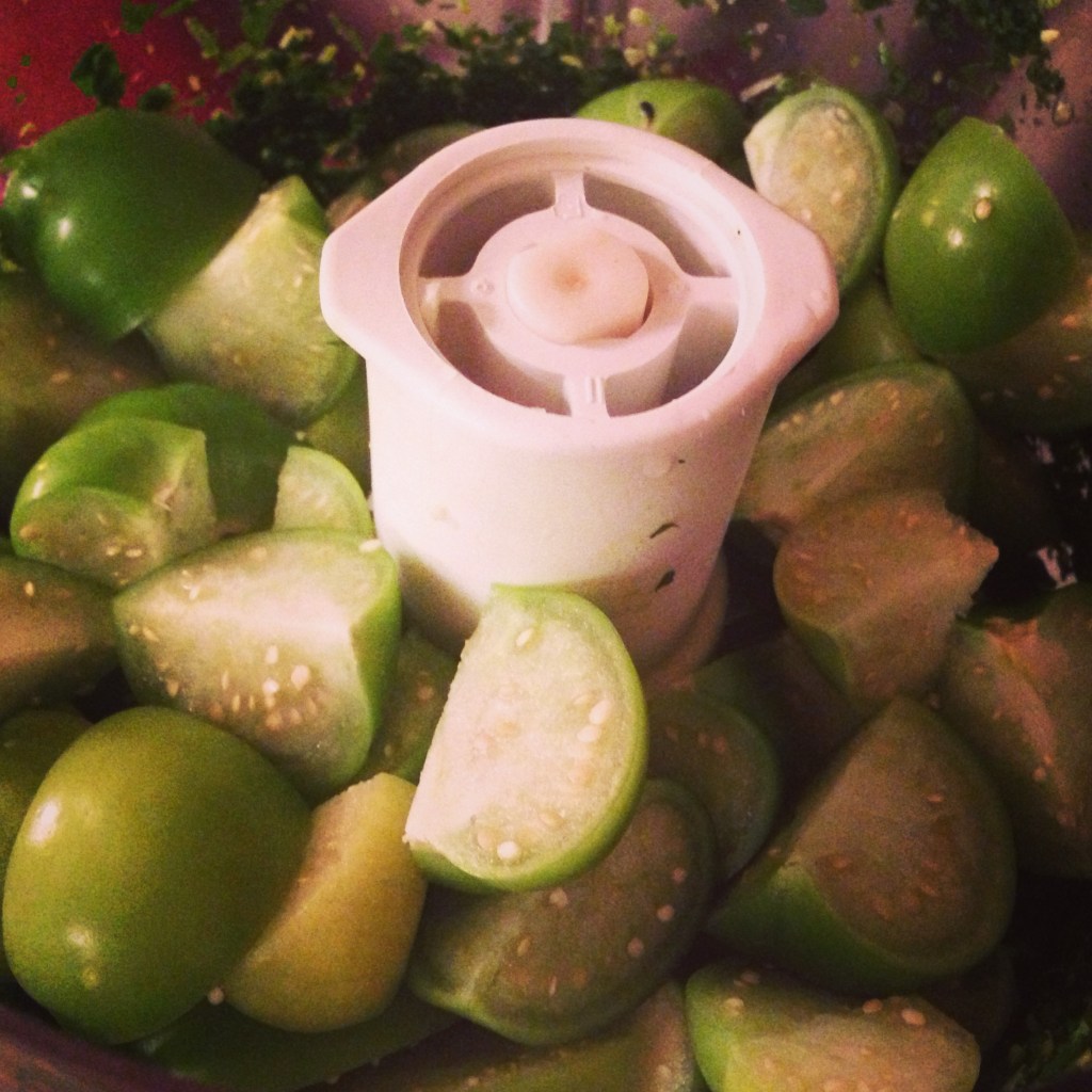 chopping up tomatillos in the food processor